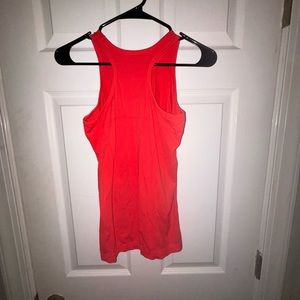 Athleta girl tank top fits like women’s size small but is a kids size 14
